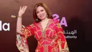 إلهام شاهين تتألق بفستان فوشيا في العرض الخاص لفيلم 7DOGS