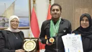 محافظ بورسعيد يكرم أسرة شهيد وبطل سباحة من ذوي الهمم